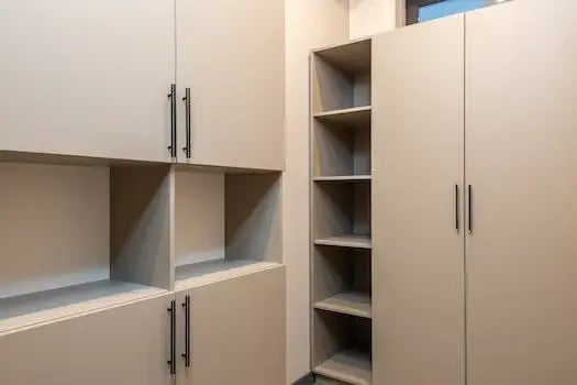 Empty built-in cabinets and shelving in a room